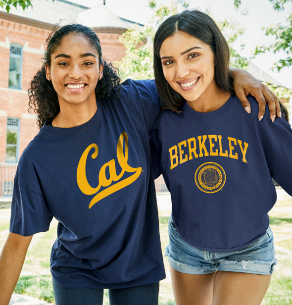 A couple of girls wearing cal champion t-shirts